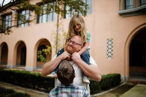 Small Group Prints: Dad with Daughter on Shoulders as Son Looks On in San Diego