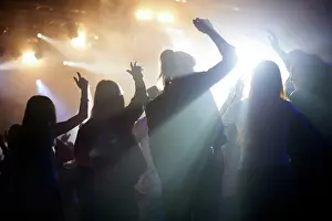 Live Prints: Dance, silhouette of people at music festival from back