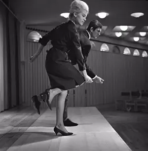 1960s Prints: Dancing in the 1960s. The dance Hully Gully is being made popular and here are men and women dancing the new craze
