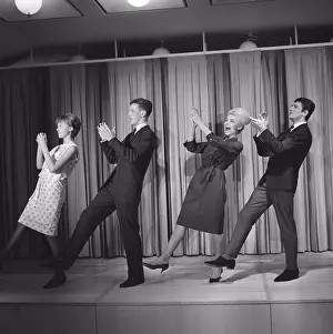 1960s Prints: Dancing in the 1960s. The dance Hully Gully is being made popular and here are men and women dancing the new craze
