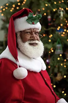 Individuality Prints: Dark portrait of an African American Black man dressed as Santa Claus