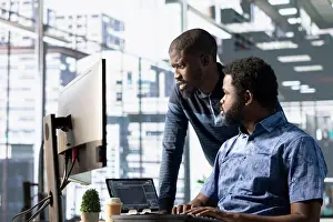 Computer Scientist Prints: Data engineering IT staff members at PC desk developing machine learning algorithms