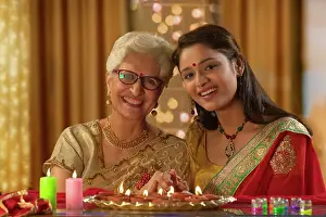 Occasion Prints: Daughter in law decorating the house with mother in law on the occasion of diwali