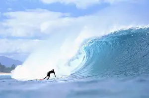 David Prints: David Cantrell out in front of large crashing wave, blue sky w/ clouds