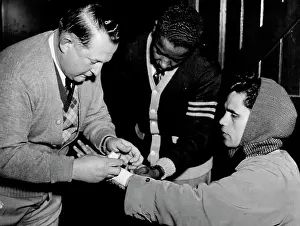 1950 Prints: Dawson's Manager Hawke ***** examines Jack Hassan *****. June 22, 1950