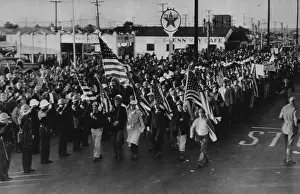 Activist Prints: Deputies Salute Flag As Film Demonstrators March -- Deputy sheriffs salute the flag being carried at the head of a