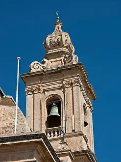 Balcony Prints: Detailed view of a baroque bell tower with decoration and blue sky in the background
