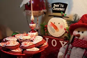 Snowman Prints: Detail of dining room table decorated for festive Christmas party with cookies and decorations