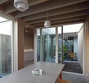 Doors Prints: Dining space with view of interior courtyard