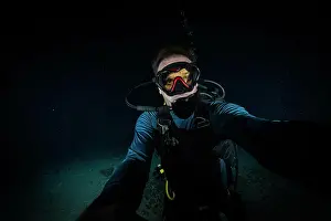 Diving Equipment Prints: Diver during a night dive in the Red Sea in Egypt