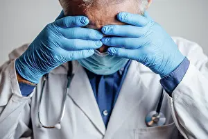 Baby Boomer Prints: Doctor desperate for rest holding his hands on his head