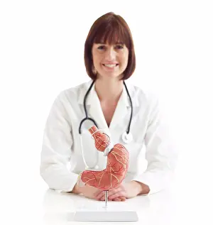 Medical Procedure Prints: Doctor with model of stomach with gastric band