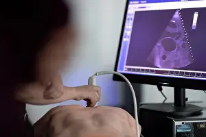 Gadget Prints: a doctor performs ultrasound on a teaching dummy