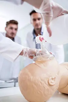 Respiratory Prints: Doctor practising bag-valve-mask ventilation on dummy