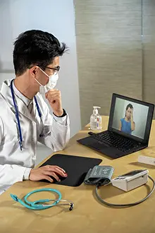 Migraine Prints: Doctor in remote consultation with a 30-year-old female patient with head pain