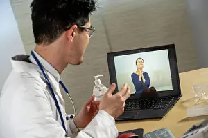 Woman Patient Prints: Doctor in remote consultation with 30 year old female patient with pain in her throat
