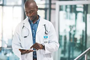 Doctor with tablet, happy reading social media post