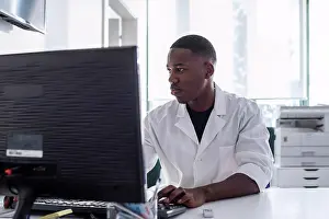 Connections Prints: Doctor working on computer in hospital