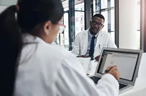 Doctors Prints: Doctors, meeting and research together on laptop for health