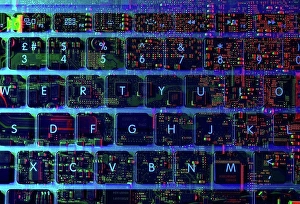 Lighted Prints: Double exposure of the inside and out of a laptop computer showing the electronic components under the keyboard