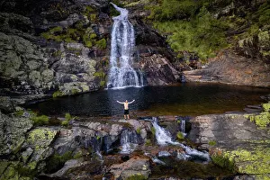 Hike Prints: Drone aerial view of a caucasian man on Fisgas de Ermelo waterfall