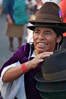 Ecuador Prints: Ecuador, An indigenous woman sells hats favoured by Indian women at the weekly Sangolqui market