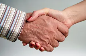 Business Women Prints: Elderly man and younger woman shaking hands