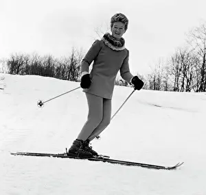 Cold Temperature Prints: Elegant woman smiling and skiing