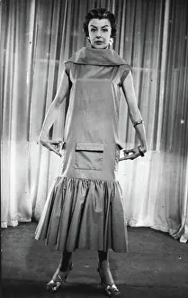Fashions Prints: The 'Elongated Look' In The New Spring Collections -- A novel summer frock or beach dress featuring the new