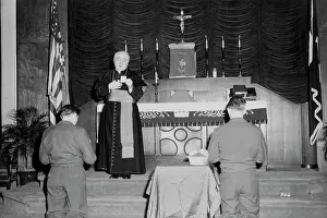 Cardinal Prints: His Eminence Francis Cardinal Spellman offers a prayer following mass in the Finance Building Chapel