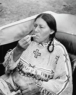 Indians Prints: The End of A Perfect day -- Red Cloud Woman Lights her Cigarette with the lights from the swanky car they rented for