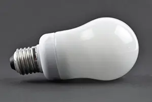 2018 Prints: Energiesparlampe auf schwarz - Energy saving lamp on black background Energiesparlampe auf schwarz - Energy saving lamp