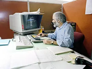 Archives Prints: An engineer uses the computer aided design (CAD)