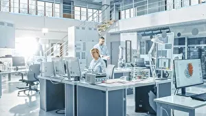 Innovation Prints: Engineer working on a computer