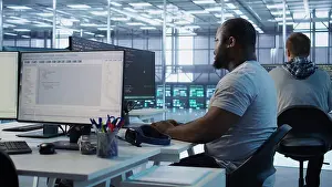 Network Prints: Engineer writing code and doing checkup on server room providing computing resources for different workloads
