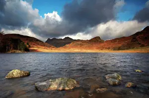 England Prints: England, Cumbria, Blea Tarn. Sunlight lighting up the distant shore of Blea Tarn