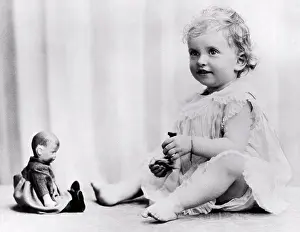 Human Representation Prints: England: July 14, 1925 A portrait of Patricia Mountbatten playing with her dolls