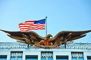 Imposing Prints: England, London, Mayfair. The Bald Eagle and stars and stripes flag on top of the US embassy