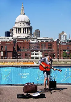 Capital Prints: England, London, Millbank. A street performer outside the Tate Modern gallery