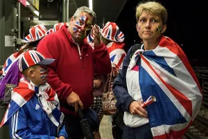Stadiums Prints: England, London, Stratford. A group of British fans return home after a day at a sporting event