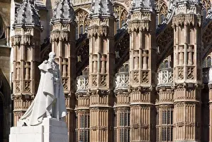 Monument Prints: England, London, Westminster. Statue of George V with Westminster Abbey in the background
