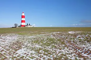 Nautical Prints: England, Norfolk, Happisburgh. Winter snow in a field by Happisburgh lighthouse