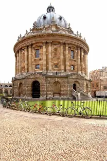 Students Prints: England, Oxfordshire, Oxford. Bicycles chained to the fence encircling the Radcliffe Camera building