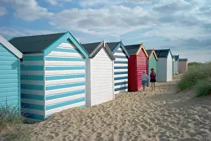 Huts Prints: England, Suffolk, Southwold, Group of brightly coloured beach huts near Gun Hill