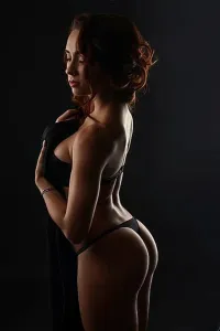 Chic Prints: Erotica. Sensual pretty woman posing in studio, on gray background