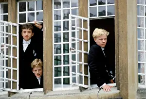 Boarding Prints: Eton schoolboys in traditional tails looking through the window at Eton College