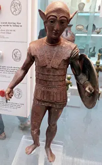 Helmet Prints: Etruscan, bronze votive statuette of a warrior with a shield