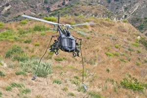 Afternoon Prints: Eurocopter AS350 Ecureuil A-Star Helicopter flying over the hills of Malibu