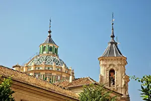 Europe, Spain, Granada. The baroque facade dome and bell tower of the Iglesia de San Juan de Dios