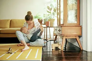 Feed Prints: Family, breastfeeding and mother and baby in home for bonding